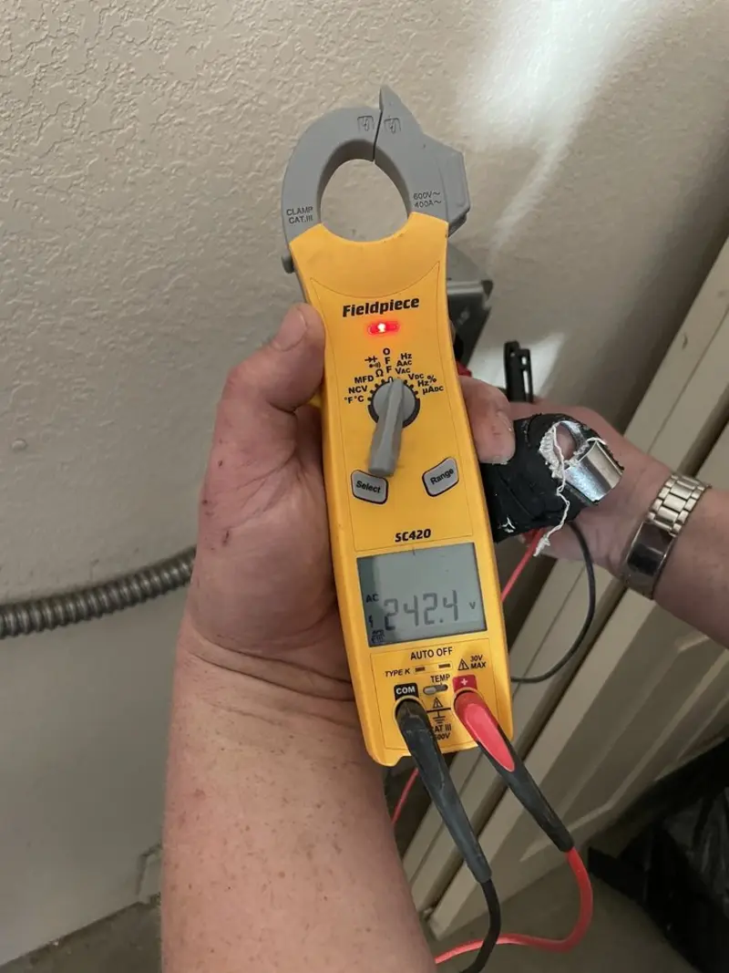Voltage testing with clamp meter during Ceiling Fan Installation in Mentone